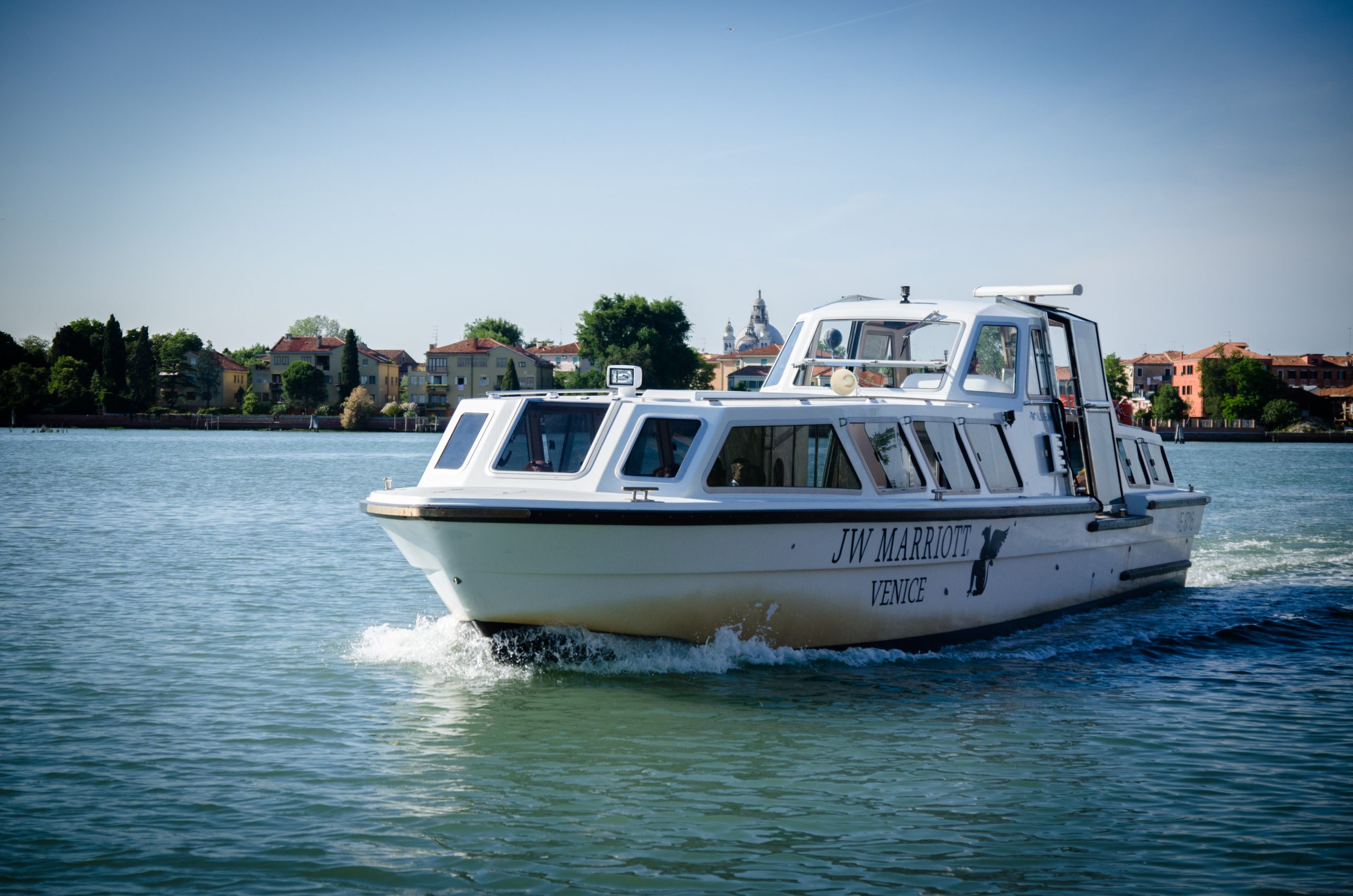 JW Marriott Venice water taxi travelling across the lagoon